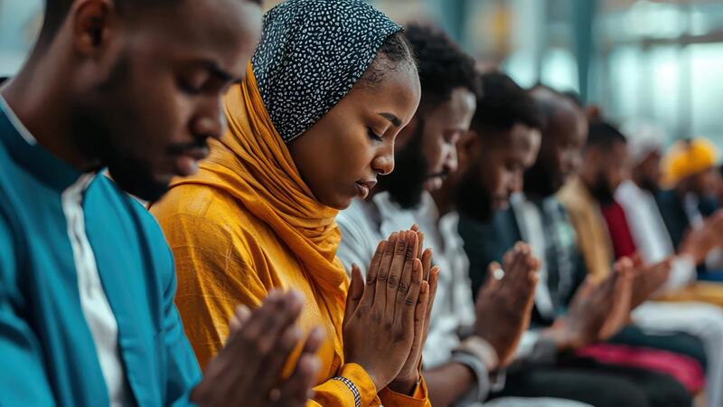 Group of believers praying together in unity
